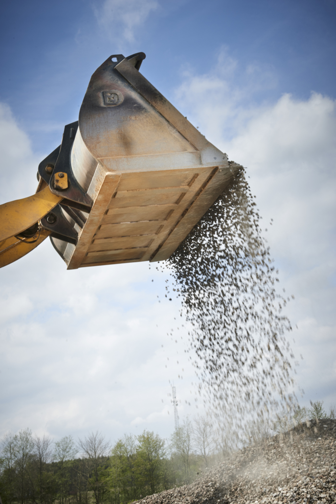 Excavator moving sand in a gravel pit